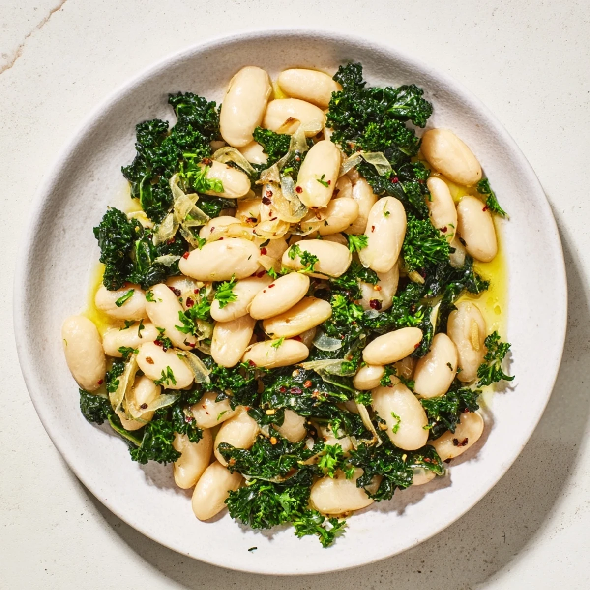 Steaming Garlicky Beans with Winter Greens, vibrant green hues and creamy beans are ready to serve.