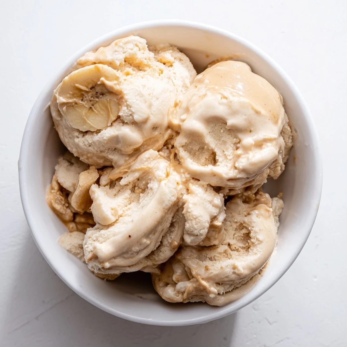 Homemade Peanut Butter Banana Ice Cream with a rich, peanut butter aroma, served with a hint of vanilla flavor.
