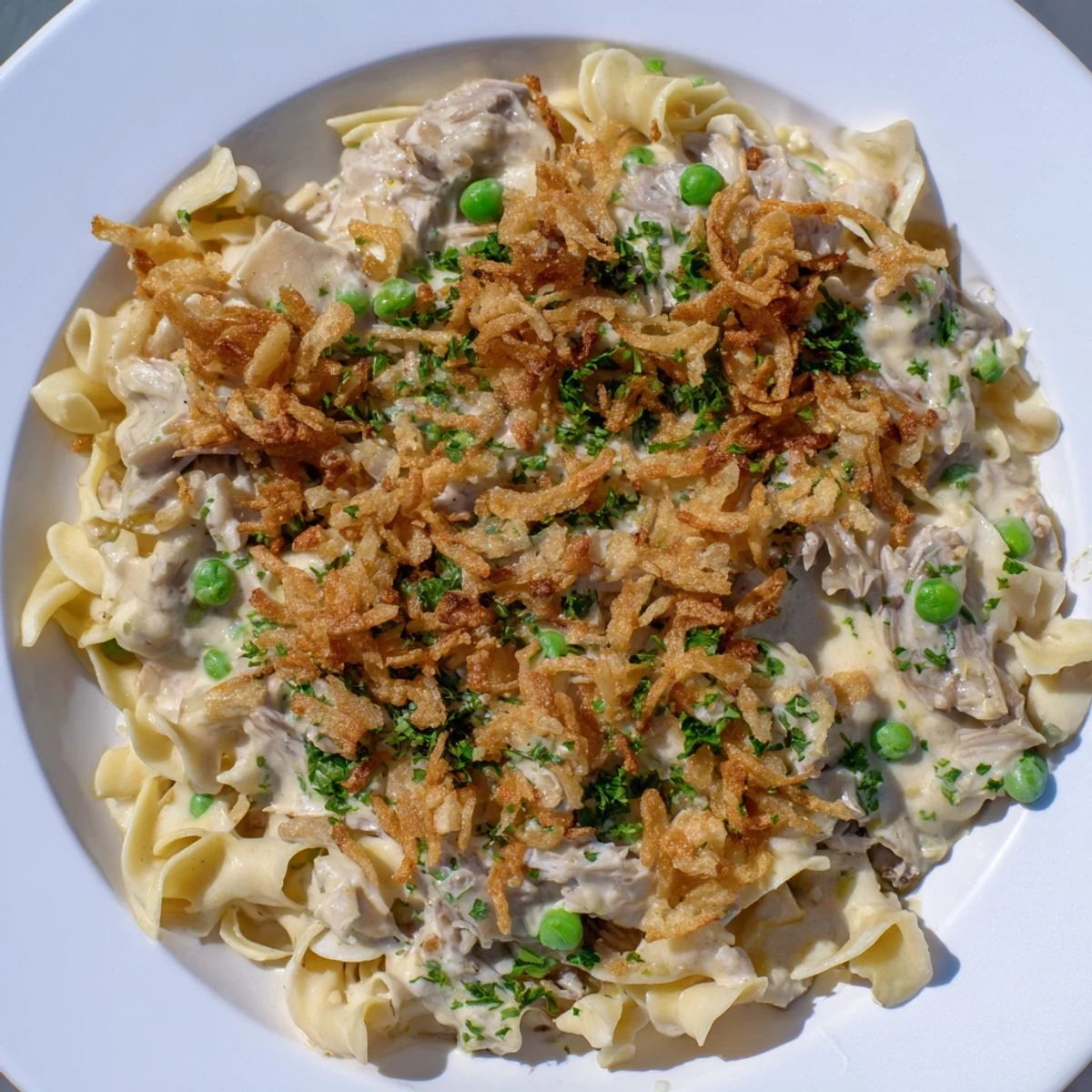 A creamy, cheesy Tuna Noodle Casserole, showcasing tender noodles and a satisfying golden-brown crust.