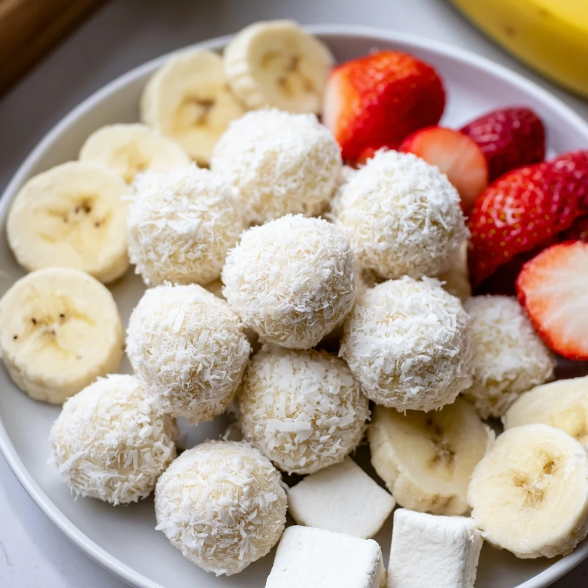 A festive Marshmallow Snowball Dip Platter awaits, offering delicious coconut-covered treats to enjoy.