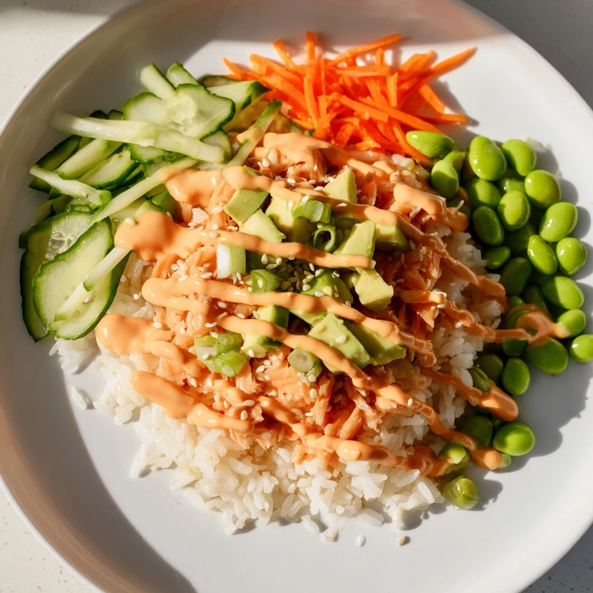 Enjoy a quick and easy Spicy Canned Salmon Rice Bowl, featuring flaky salmon atop fluffy rice.