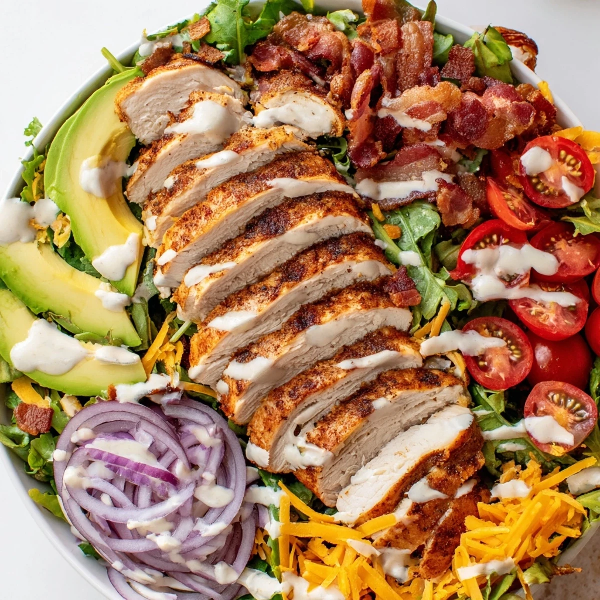 Crispy Bacon Chicken Salad with juicy chicken, crunchy bacon, and fresh greens, drizzled with creamy ranch.