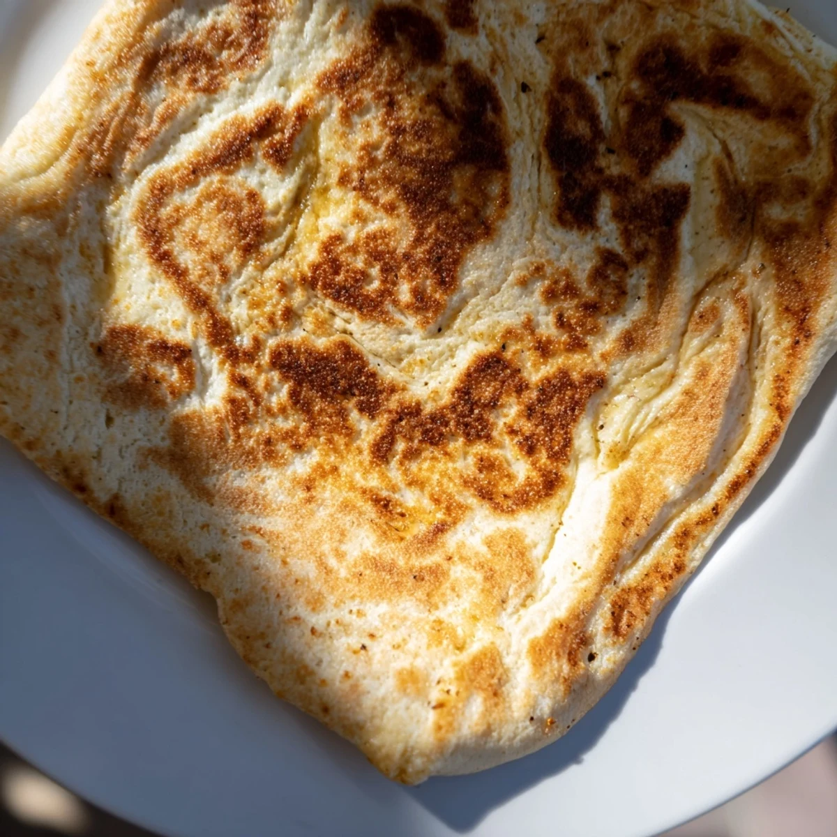 Warm, golden Cottage Cheese Flatbread, perfect for dipping, smells wonderfully of fresh baking.