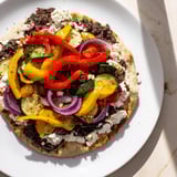 Warm naan bread pizza, topped with olive tapenade, feta, and perfectly roasted veggies.