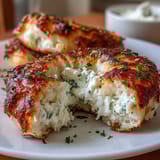 2. Chewy, protein-packed bagels infused with garlic and herbs, served with a creamy cottage cheese spread.  