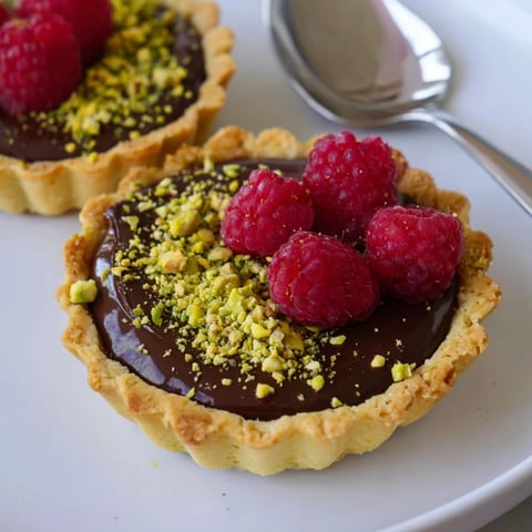 Indulge in these chocolate ganache tartlets with a buttery crisp shell.  