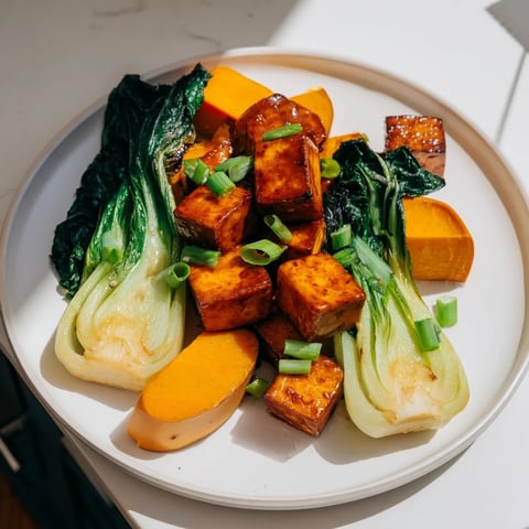 Golden, caramelized miso-glazed tofu next to tender roasted winter squash and bok choy.
