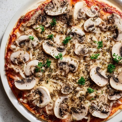 Gourmet frozen pizza upgrade with melted cheese, mushrooms, and herbs, perfect for dinner.