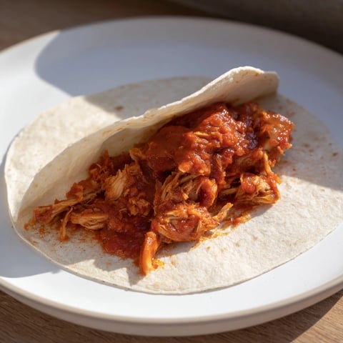 Steaming Crock-Pot Shredded Chicken Tacos piled high, ready to fill warm tortillas with flavorful chicken.