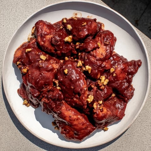 Hearty Budget Fesenjan Stew with Chicken Thighs, a rich, savory Persian dish served warm.