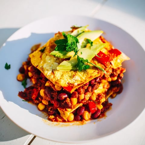Quick Black Bean and Corn Tortilla Casserole bubbling with melted cheese, a flavorful Mexican-inspired baked dish.