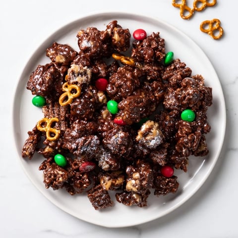 Festive, sweet Simplified Reindeer Chow mix coated in powdered sugar and ready to enjoy as a snack.