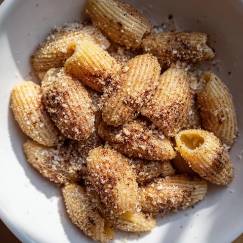 Golden, crispy Parmesan pasta chips, perfectly air-fried, ready to savor as a delicious snack.
