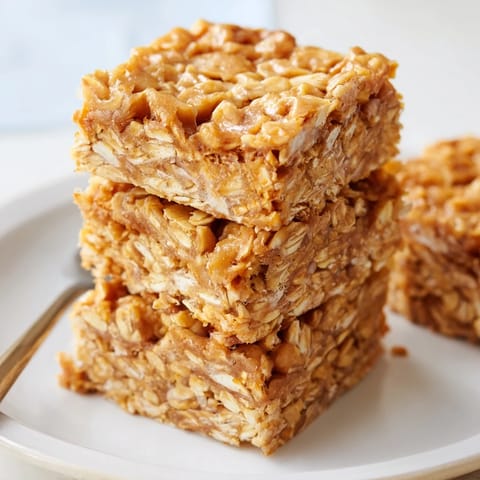 Chewy butterscotch oatmeal bars topped with golden chips for a perfect dessert.  