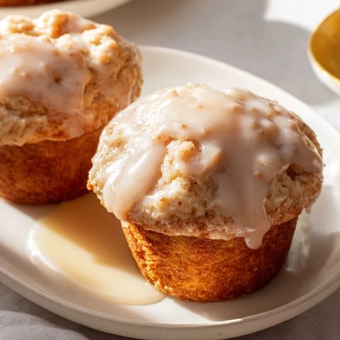 Delightful Maple Glazed Donut Muffins, drizzled with sweet glaze for breakfast bliss.  