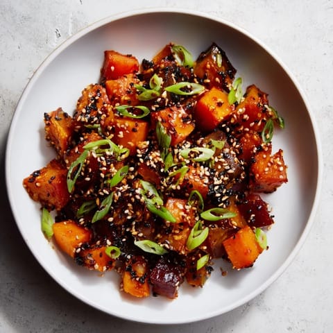 Golden-brown miso roasted winter vegetables with a sweet and salty miso glaze and sesame seeds.