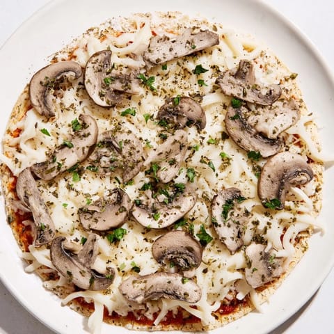 This close-up showcases the bubbly, golden cheese covering a delicious, upgraded frozen pizza.