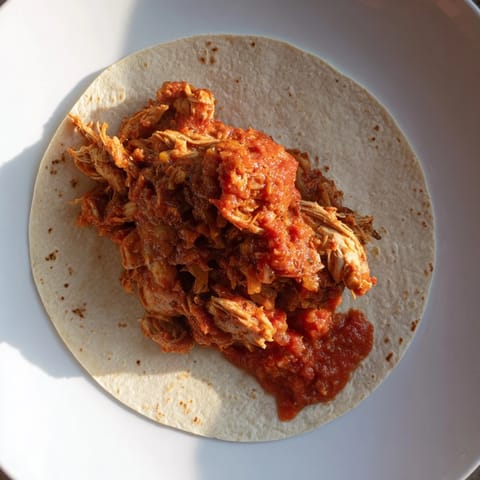 A close-up of juicy, slow-cooked Crock-Pot Shredded Chicken Tacos, ideal for a delicious weeknight meal.