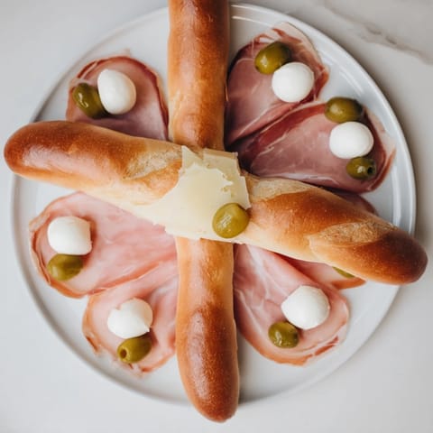 Crisp crackers and colorful Fractal Tree Branching Bread Platter ingredients arranged beautifully on a platter.
