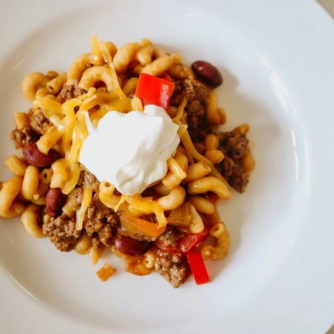 Hearty One-Pot Chili Mac shows a rich, tomato-based sauce with tender macaroni and beef.