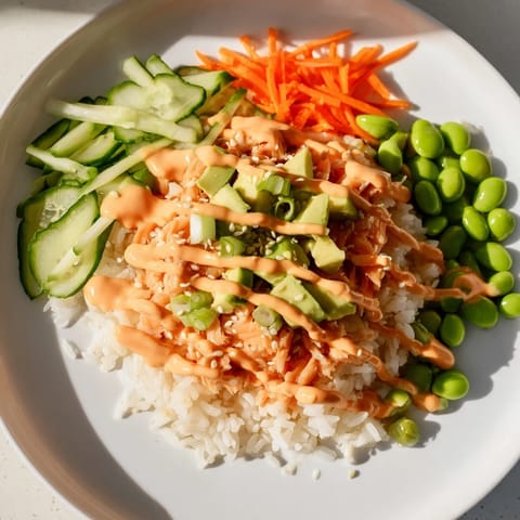 Enjoy a quick and easy Spicy Canned Salmon Rice Bowl, featuring flaky salmon atop fluffy rice.
