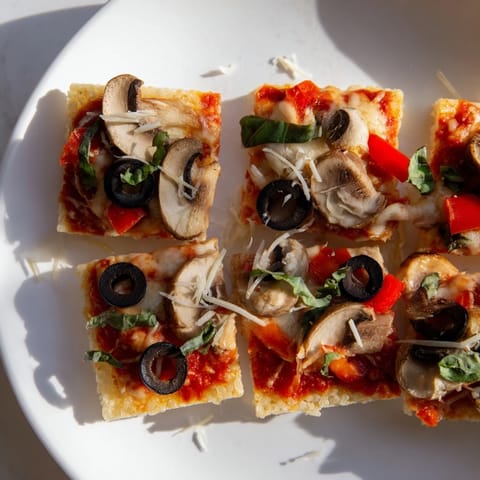 Warm Rice Cake Pizza Squares with colorful veggie toppings, fresh from the oven, ready to eat.