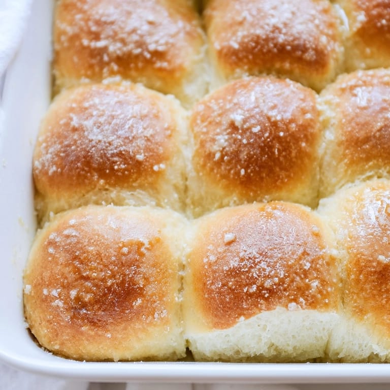 Homemade Fluffy Buttermilk Dinner Rolls, side view, showing the airy texture; ideal for dinner.