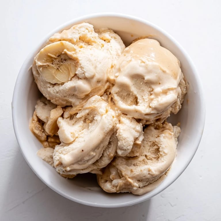 Homemade Peanut Butter Banana Ice Cream with a rich, peanut butter aroma, served with a hint of vanilla flavor.