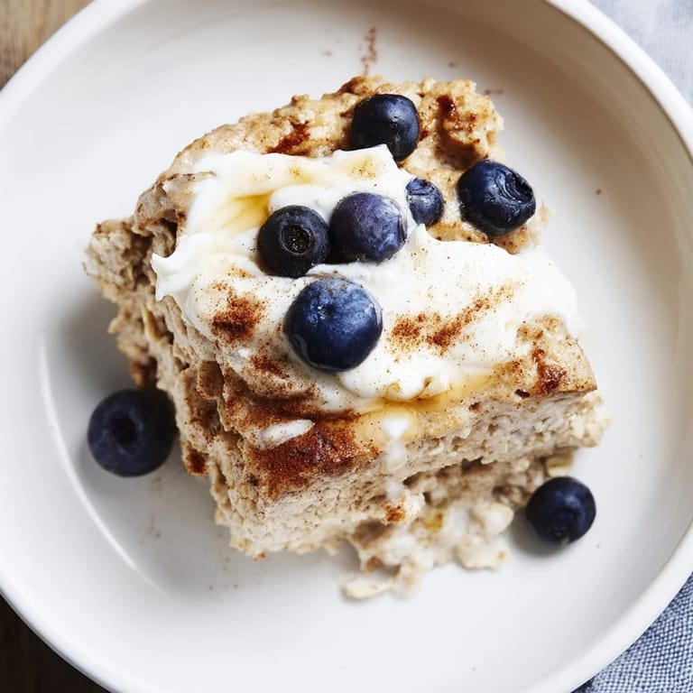 Warm, comforting Protein Pancake Oats are sliced, showing a hearty, high-protein breakfast.