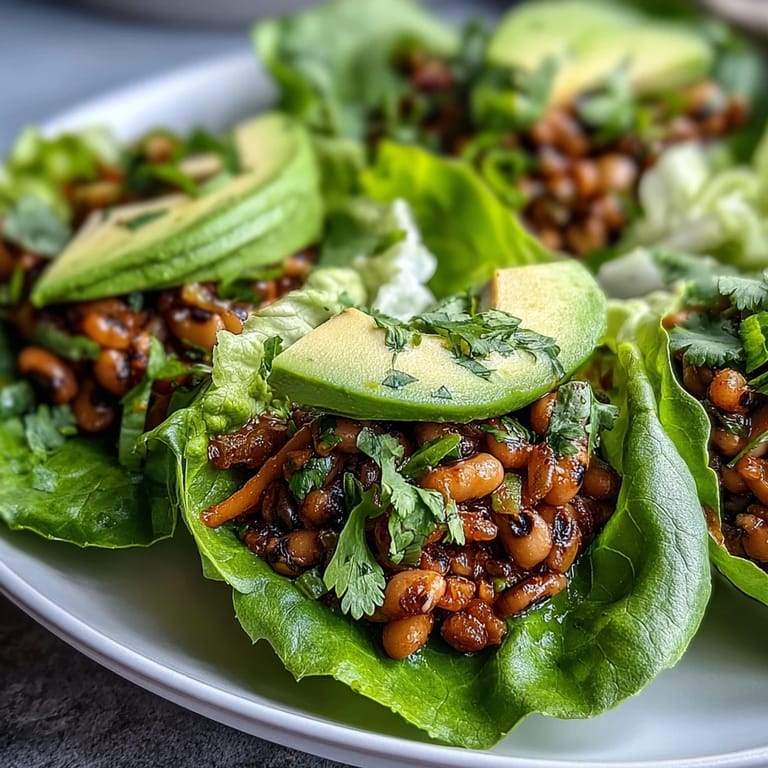 Savory Black-Eyed Pea Lettuce Wraps loaded with smoky black-eyed peas, fresh herbs, and crunchy vegetables, perfect as a healthy appetizer.