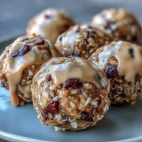 Wholesome no-bake peanut butter oat bites with mini chocolate chips, rolled into perfect bite-sized snacks for easy, healthy snacking.